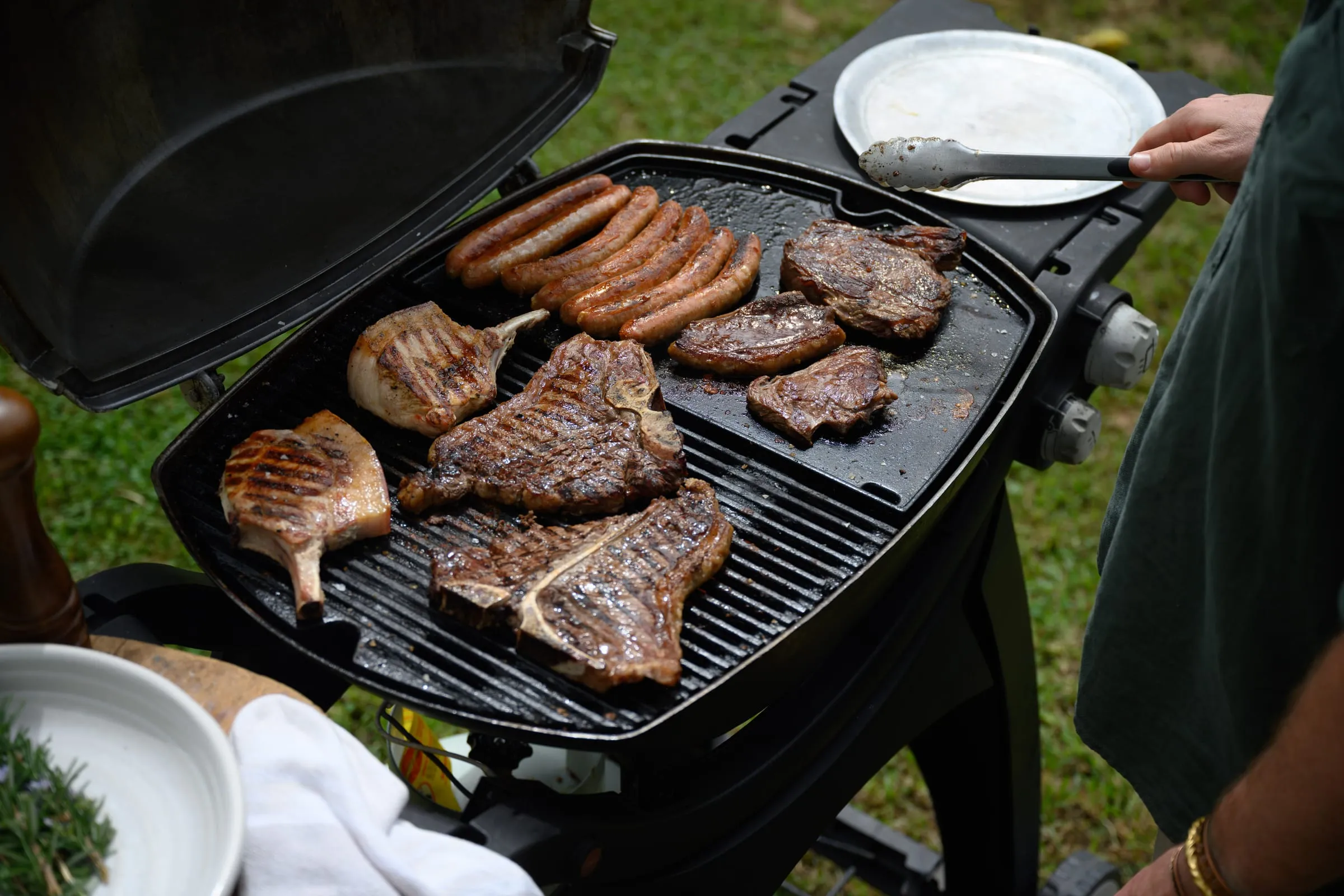 Steaks and sausages on a barbecue