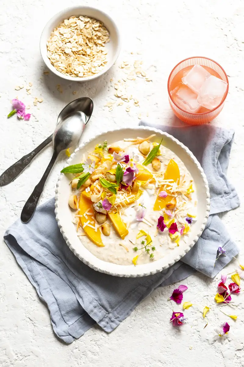 Coconut Mango Oat Pavlova Bowl, recipe by Hayden Quinn