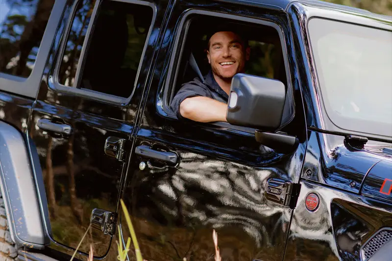 Hayden Quinn in a Jeep