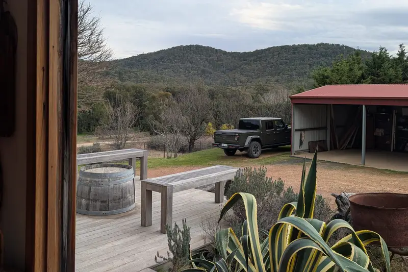 View from a veranda across a garden to the hills
