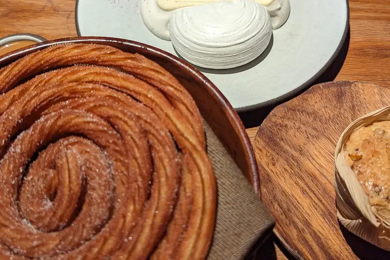 Large cinnamon bun on a restaurant table