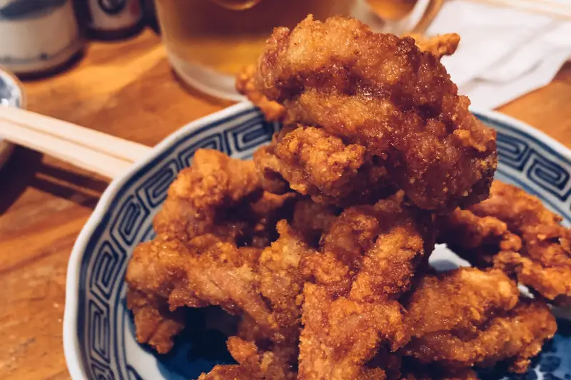Karaage with a glass of beer at Sakaba Ikura Mokuzai